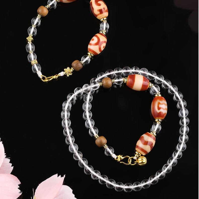 Artisan handmade red agate and white quartz necklace with old sandalwood beads, representing grounding and protection.