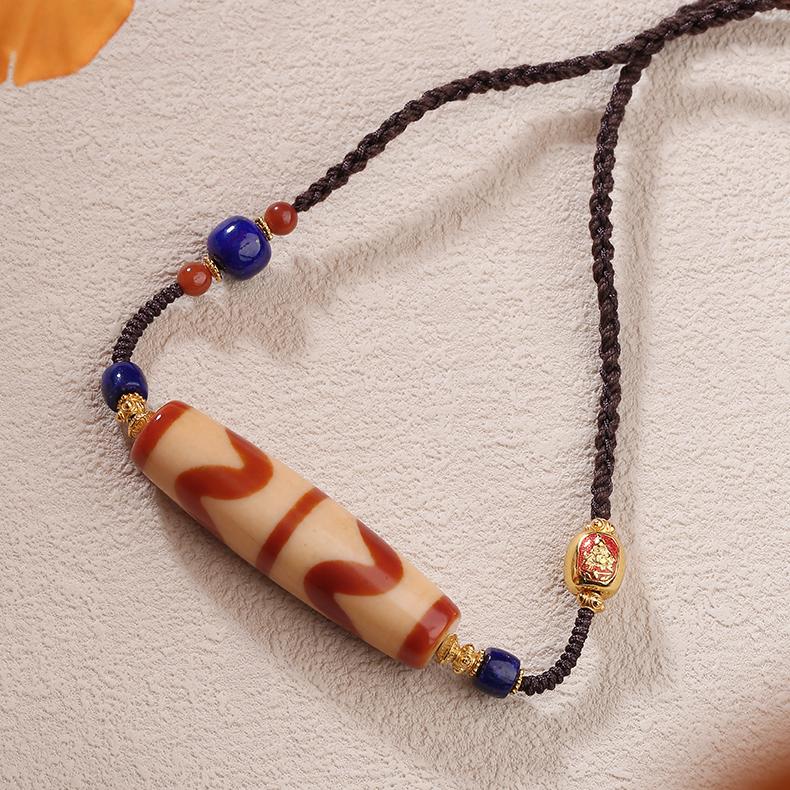 Handmade Tibetan Buddhist red agate double carnelian tooth bead pendant necklace, symbol of protection and wisdom.