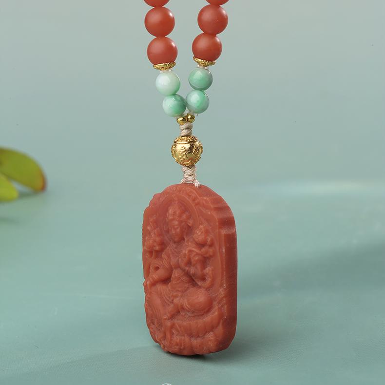 Handmade Tibetan Tara pendant necklace, featuring red agate and jade, representing enlightenment and peace.