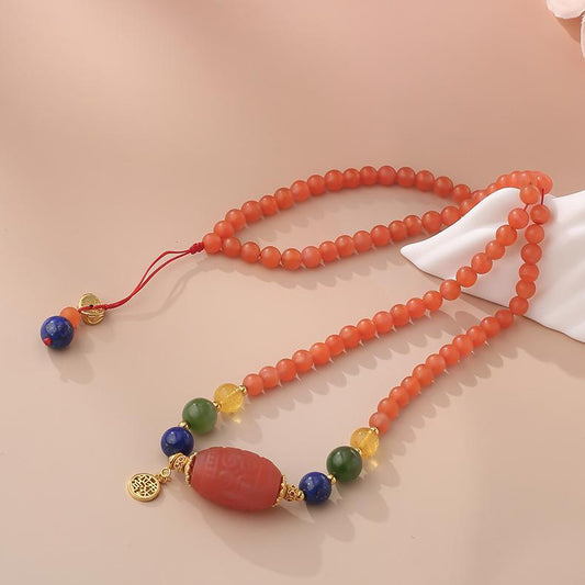 Handcrafted Tibetan Red Agate and Lapis Lazuli Pendant Necklace with s925 Silver and Amber details.