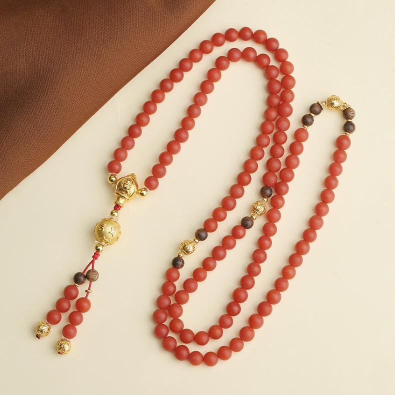 108-bead Buddhist prayer necklace crafted from red agate, agarwood, and 925 silver.