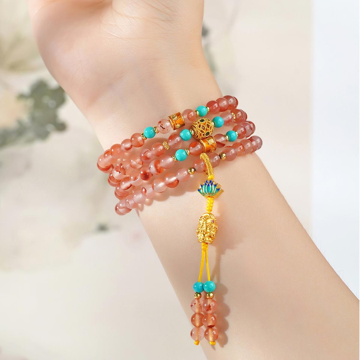 Tibetan Buddhist mala necklace with red agate beads and cubic zirconia hollow copper bead.