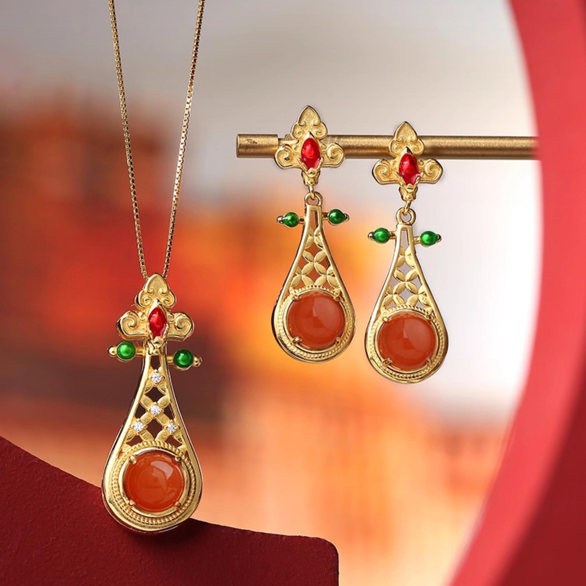 Elegant Tibetan Buddhist red agate earrings symbolizing love, vitality, and good fortune.