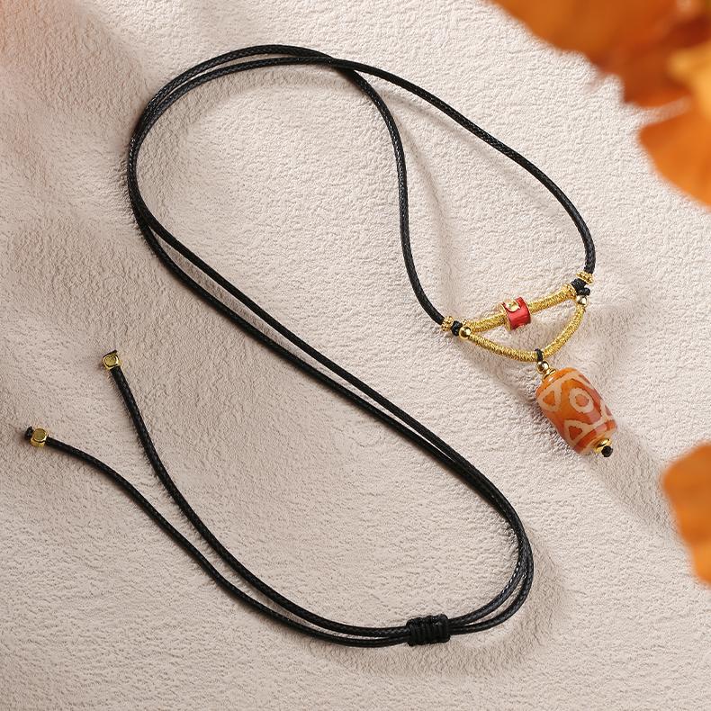 Tibetan Buddhist Dzi Bead Pendant with Three-Eye Symbolism on Adjustable Cord