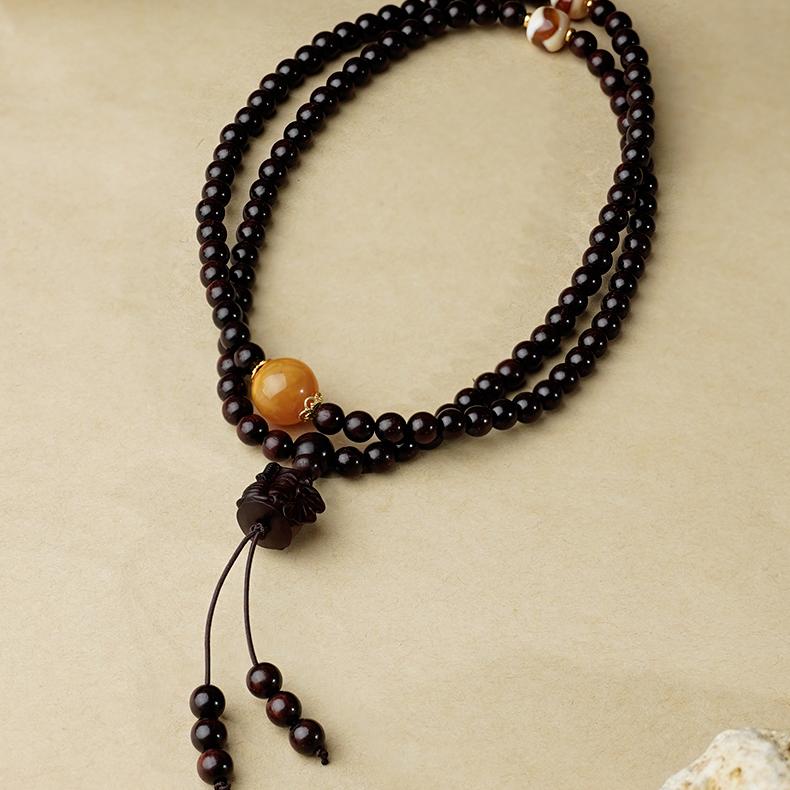 Tibetan Buddhist prayer necklace made of red sandalwood and natural amber beads