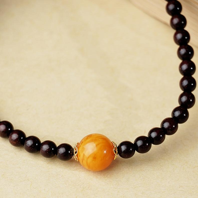 Tibetan handcrafted mala with red sandalwood, amber, and agate for mindfulness practice