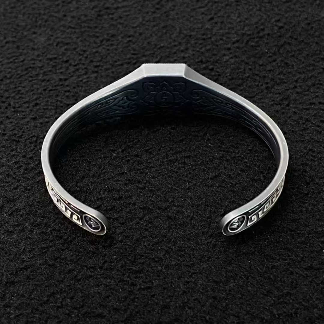 Sterling silver Green Tara jewelry bracelet with intricate handcrafted details.