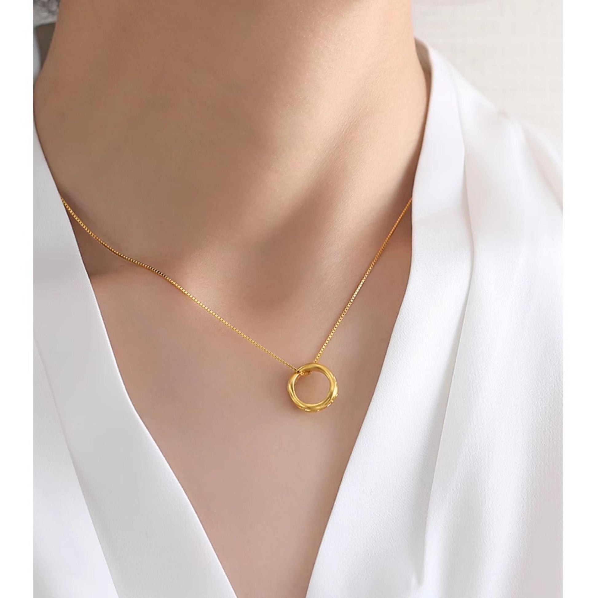 Tibetan Buddhist protective eye necklace with handcrafted golden pendant and silver chain.