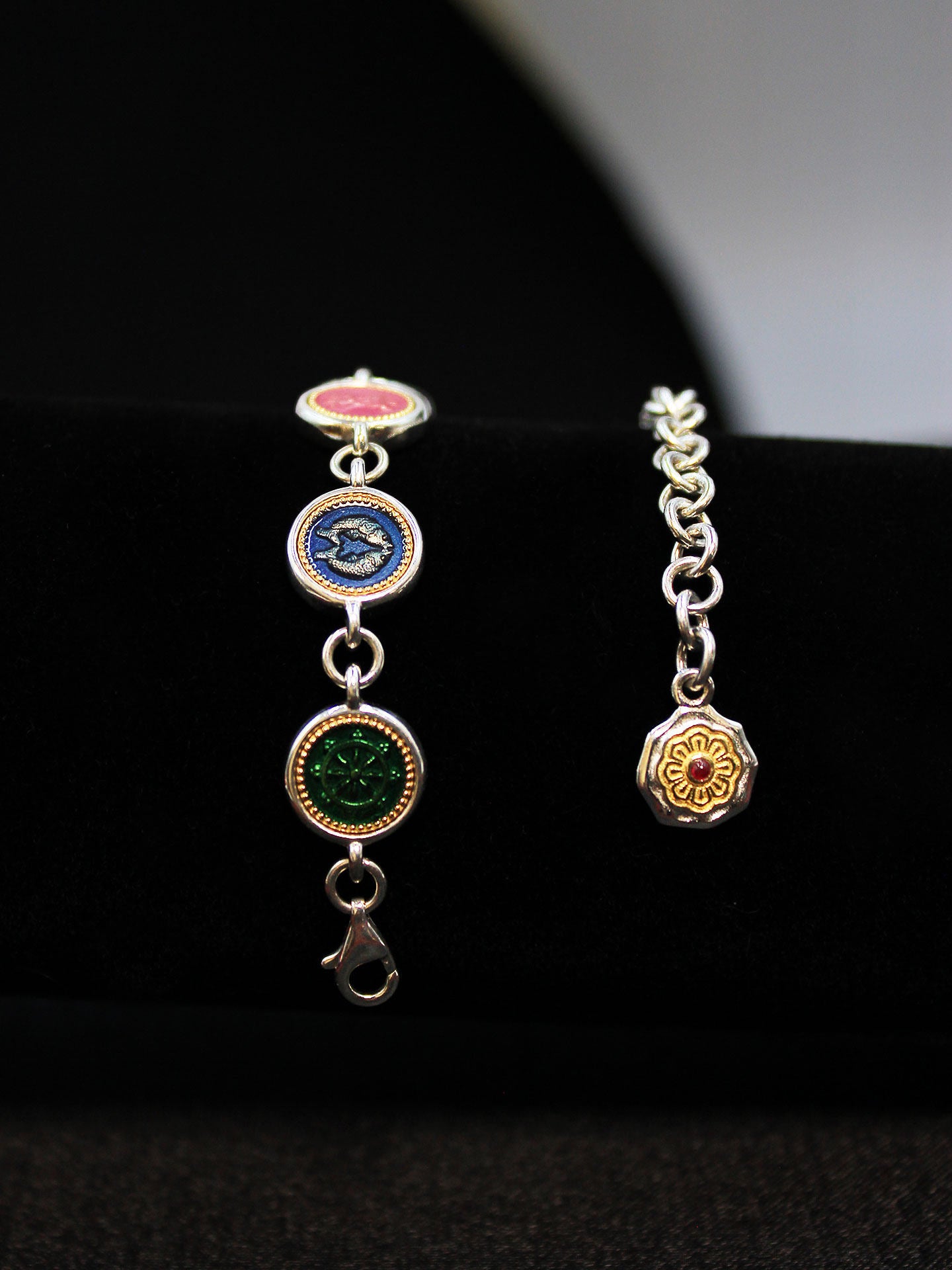 Exquisite Buddhist sacrificial items art showing hand-carved Ashtamangala charms including the Treasure Vase and Lotus for wealth and purity.
