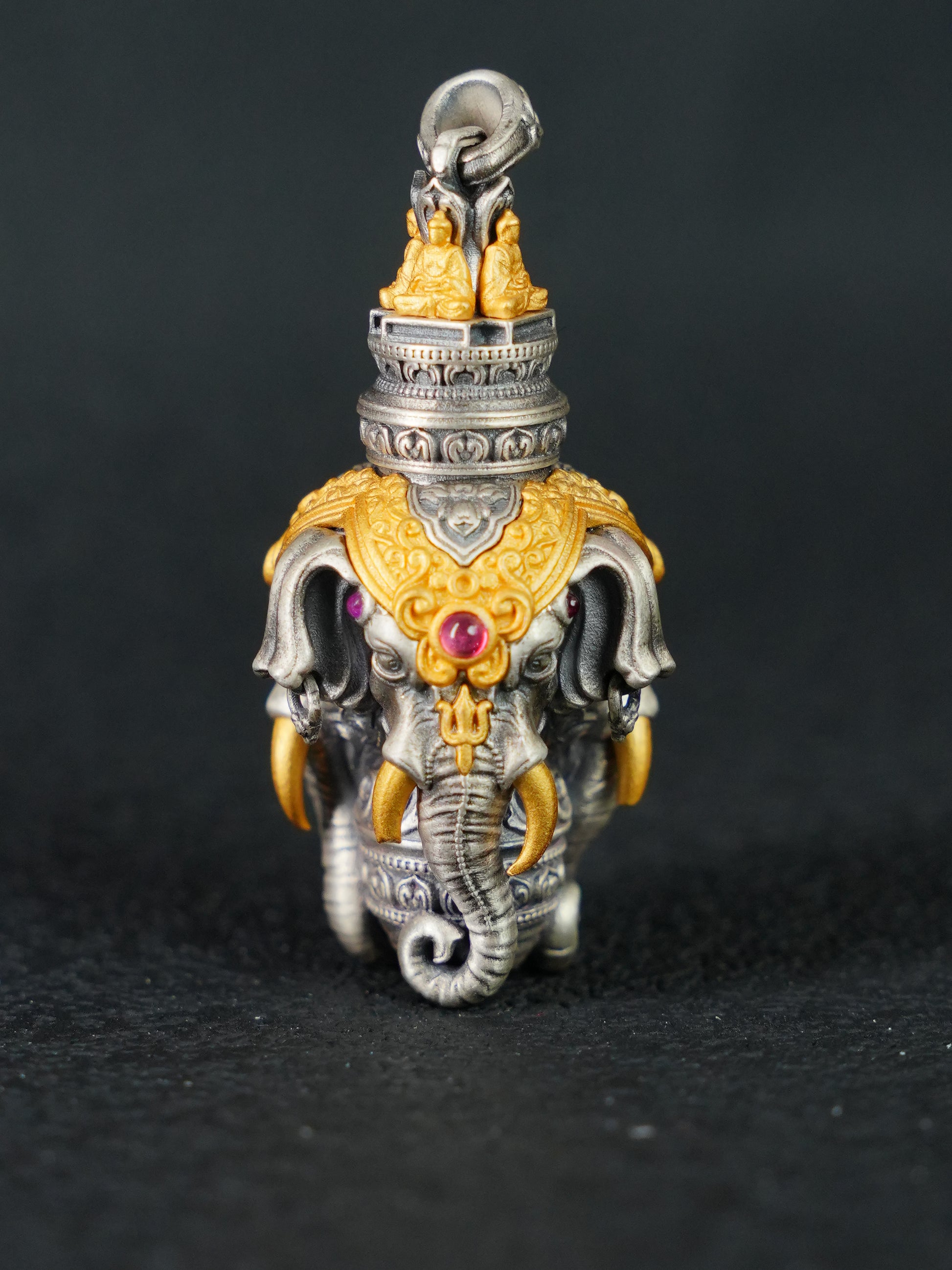 Exquisite Buddhist sacrificial items art featuring a hand-carved Ganesha with three heads, symbolizing all-around wisdom and obstacle removal.
