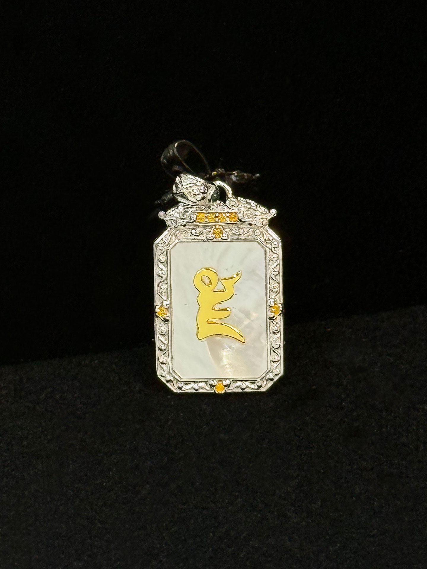 Artisan-crafted 24K gold-over-silver Jambhala pendant inspired by Tibetan Buddhist sacrificial implements culture, symbolizing abundance and merit.