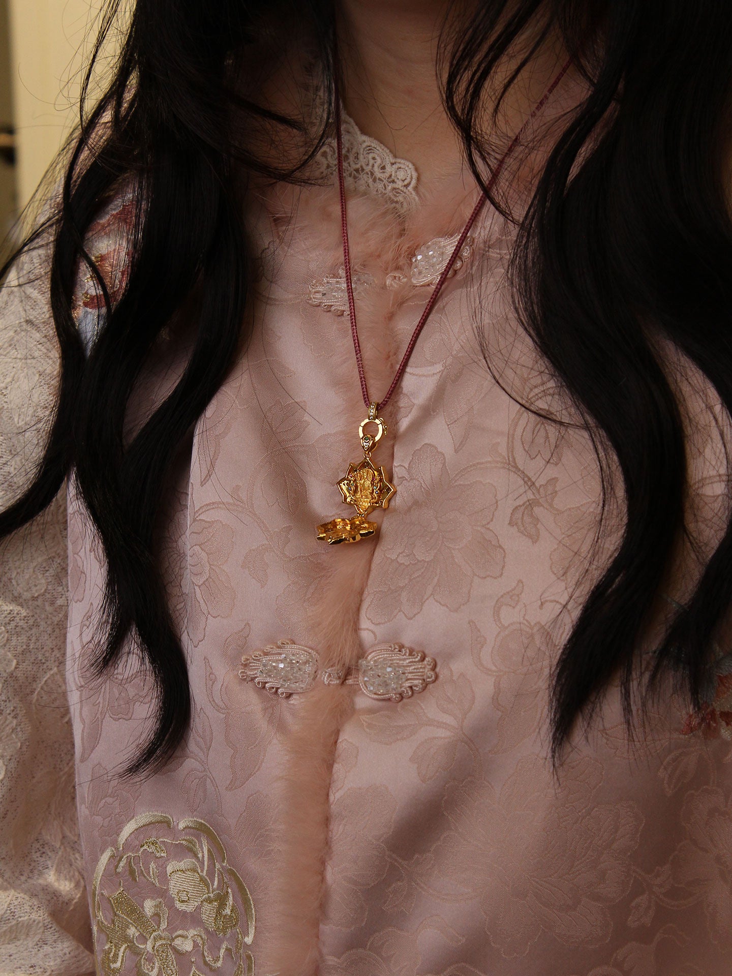 A spiritual practitioner wearing the diamond lotus Kshitigarbha talisman for karmic protection, representing Buddhist sacrificial items art.