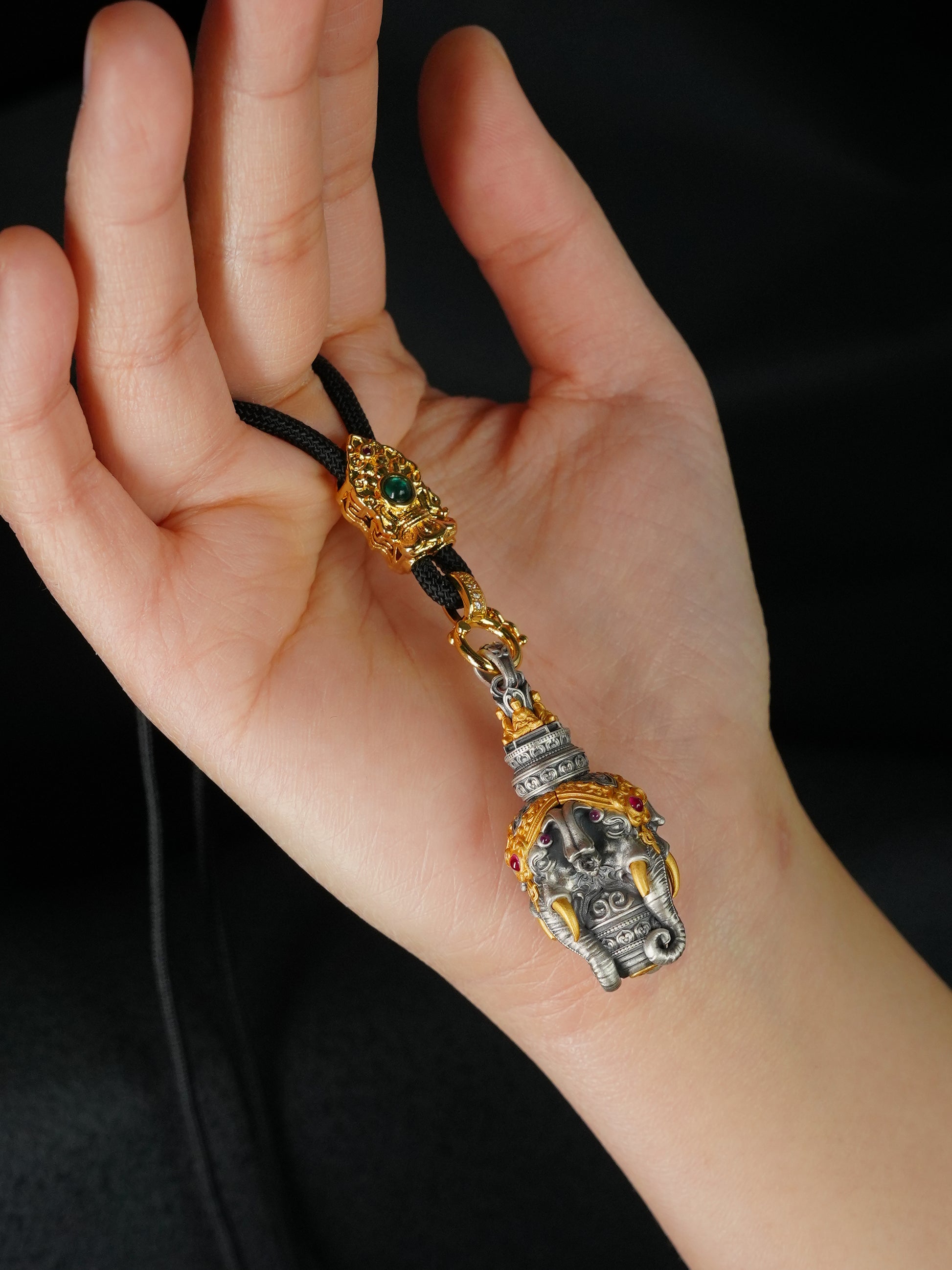 Artisan-crafted 24K gold-plated silver Elephant God amulet inspired by Tibetan Buddhist sacrificial implements culture, highlighting the sacred broken tusk detail.