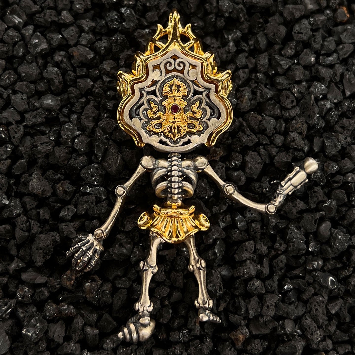 Traditional handmade gold-plated silver sacred jewelry with the Citipati skeleton design, rooted in Tibetan Buddhist sacrificial implements culture.