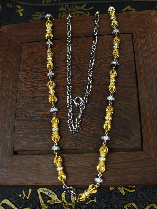 Traditional handmade gold-plated silver protection jewelry with the Vajra scepter design, rooted in Tibetan Buddhist sacrificial implements culture.
