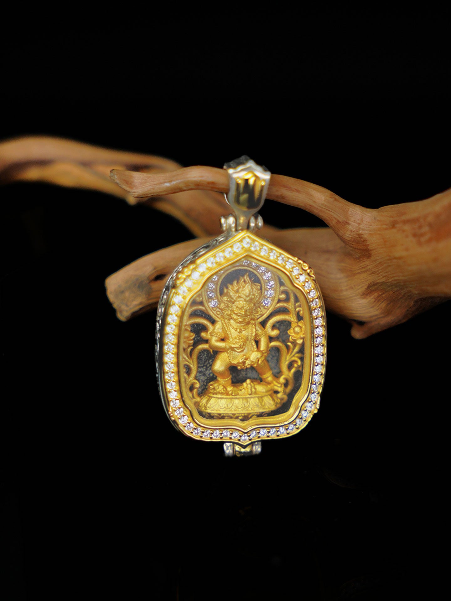 Traditional handmade Black Jambhala protection pendant with intricate lotus patterns, rooted in the deep heritage of Tibetan Buddhist sacrificial implements culture.