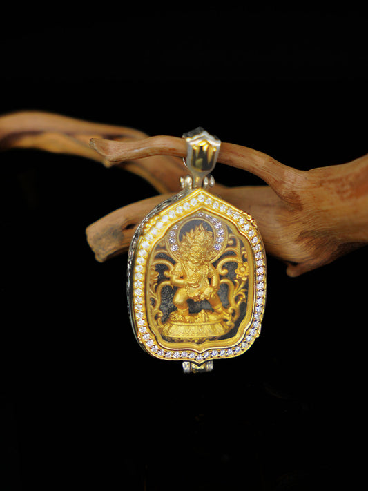 Traditional handmade Black Jambhala protection pendant with intricate lotus patterns, rooted in the deep heritage of Tibetan Buddhist sacrificial implements culture.