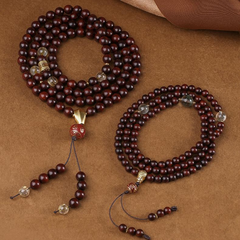Handcrafted Tibetan Buddhist mala necklace with 108 sandalwood beads and green phantom crystal elements