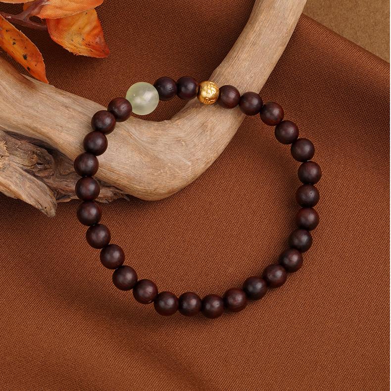 Tibetan-Buddhist sandalwood bracelet featuring prehnite gemstones and 925 silver Potala detail