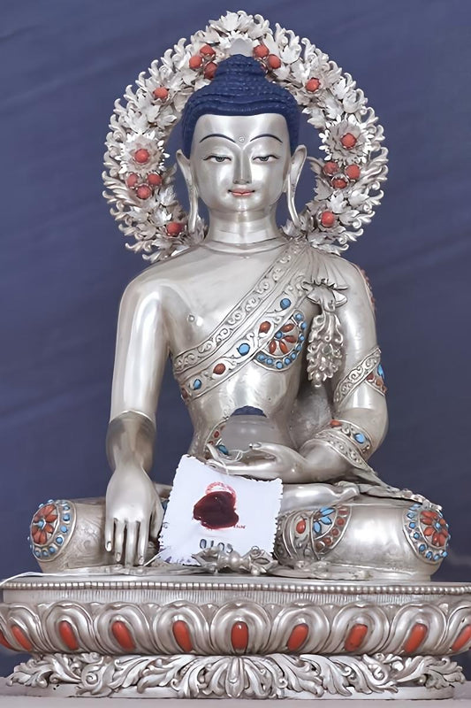 Exquisite Tibetan-buddhist silver Shakyamuni statue, handmade and hand-painted, representing authentic Tibetan Buddha art.