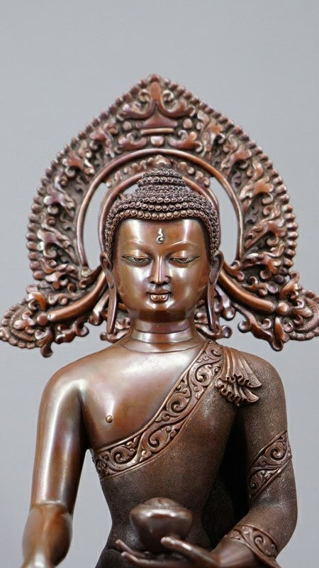 Tibetan Shakyamuni Buddha Statue in copper with mineral pigments, representing peace and wisdom, a beautiful addition to any Buddhist shrine or home.