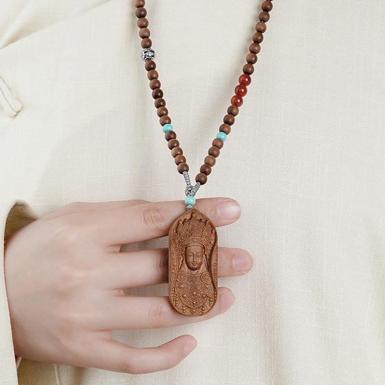 Sacred Tibetan Buddhist Laosandan necklace with silver and gemstones for meditation.