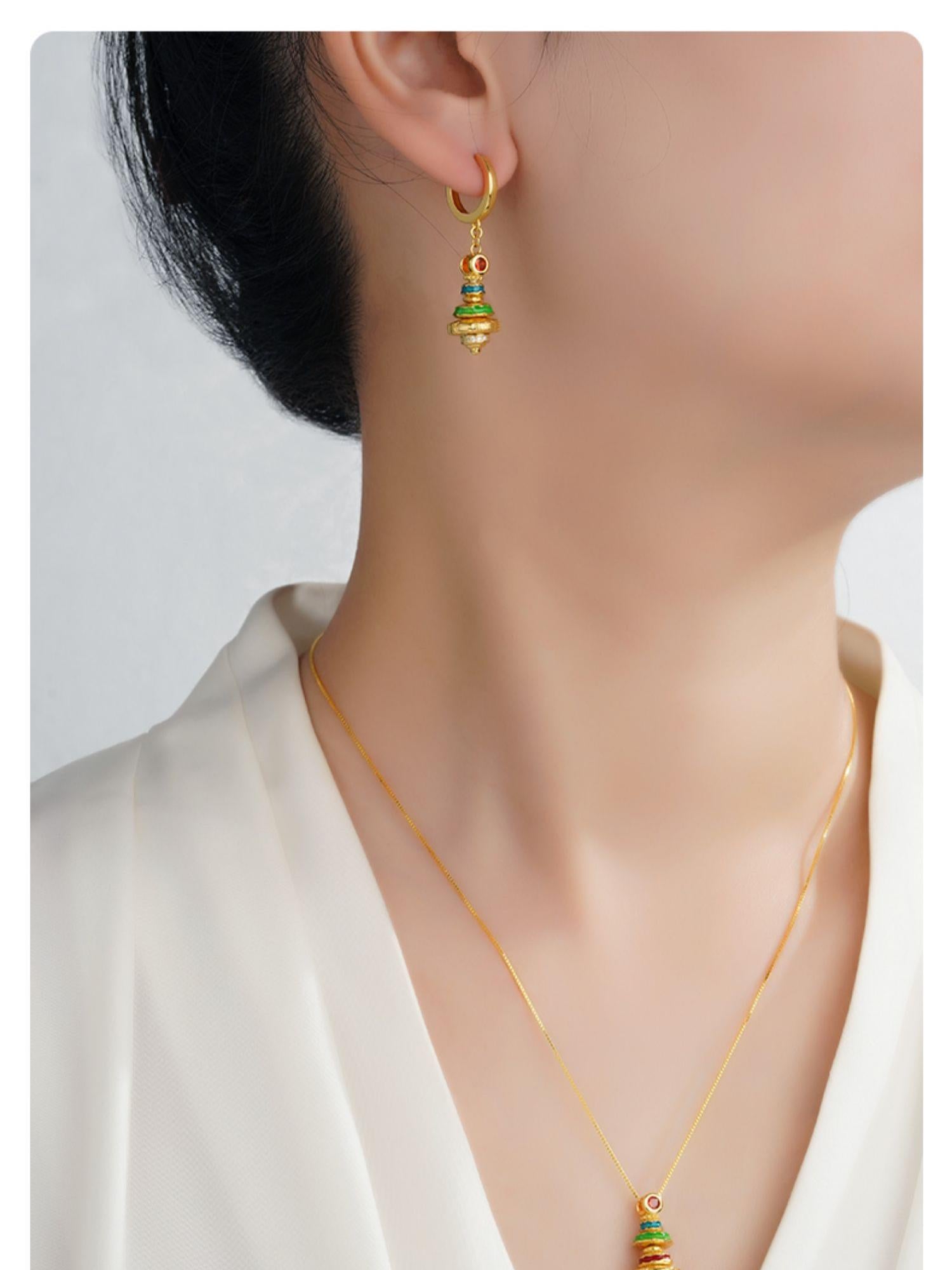 Tibetan Buddhist jewelry earrings representing spiritual completeness and artistic craftsmanship.