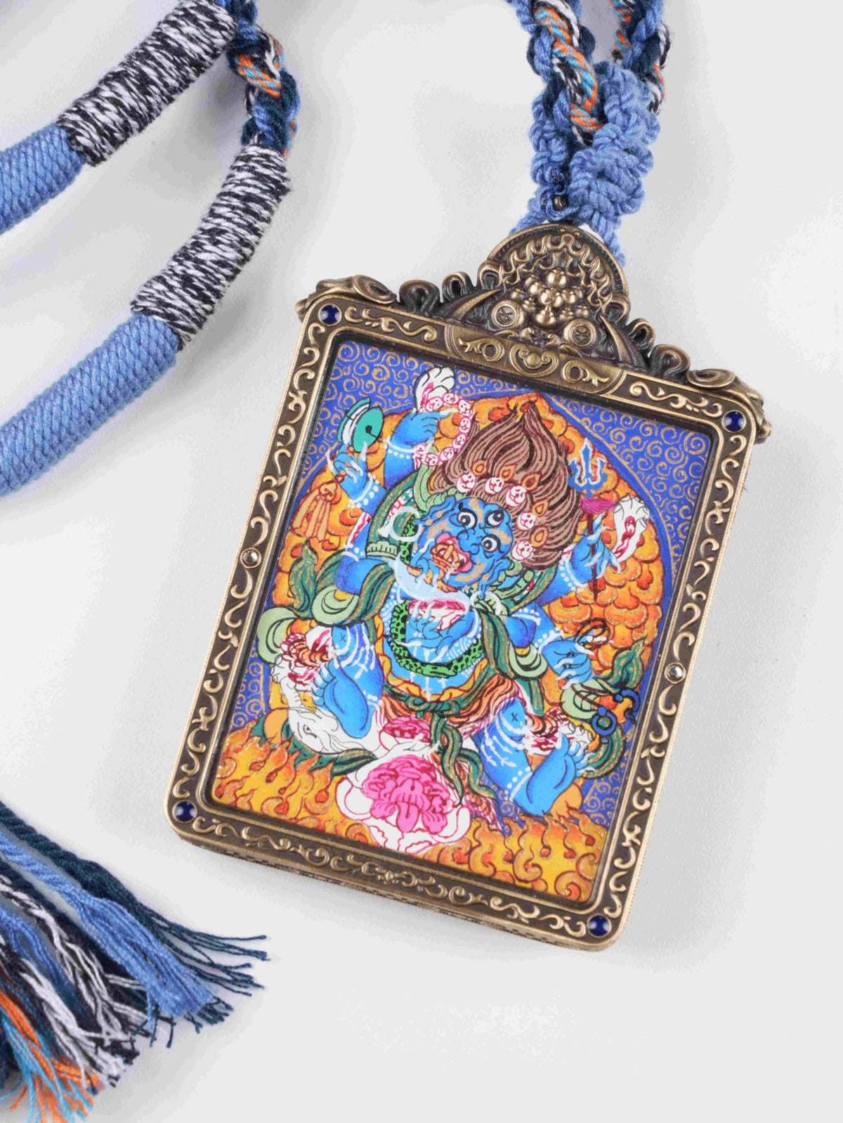 Authentic hand-painted Six-Armed Mahakala Thangka artwork in portable Gau box pendant form.