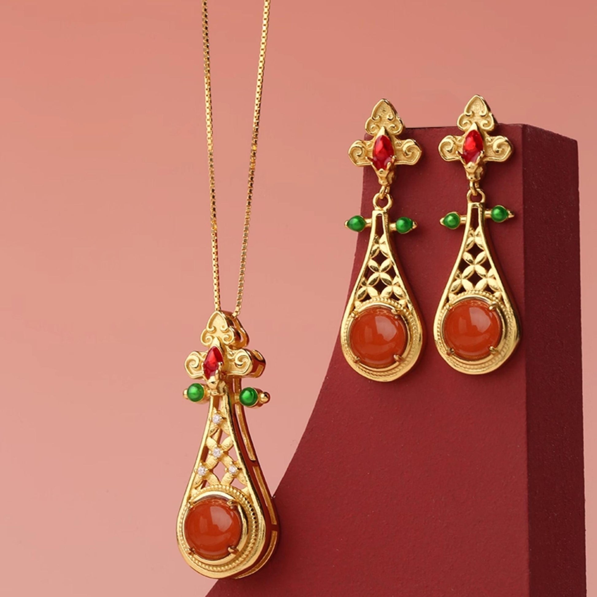 Tibetan-inspired 925 silver red agate earrings with fine craftsmanship and sacred design.