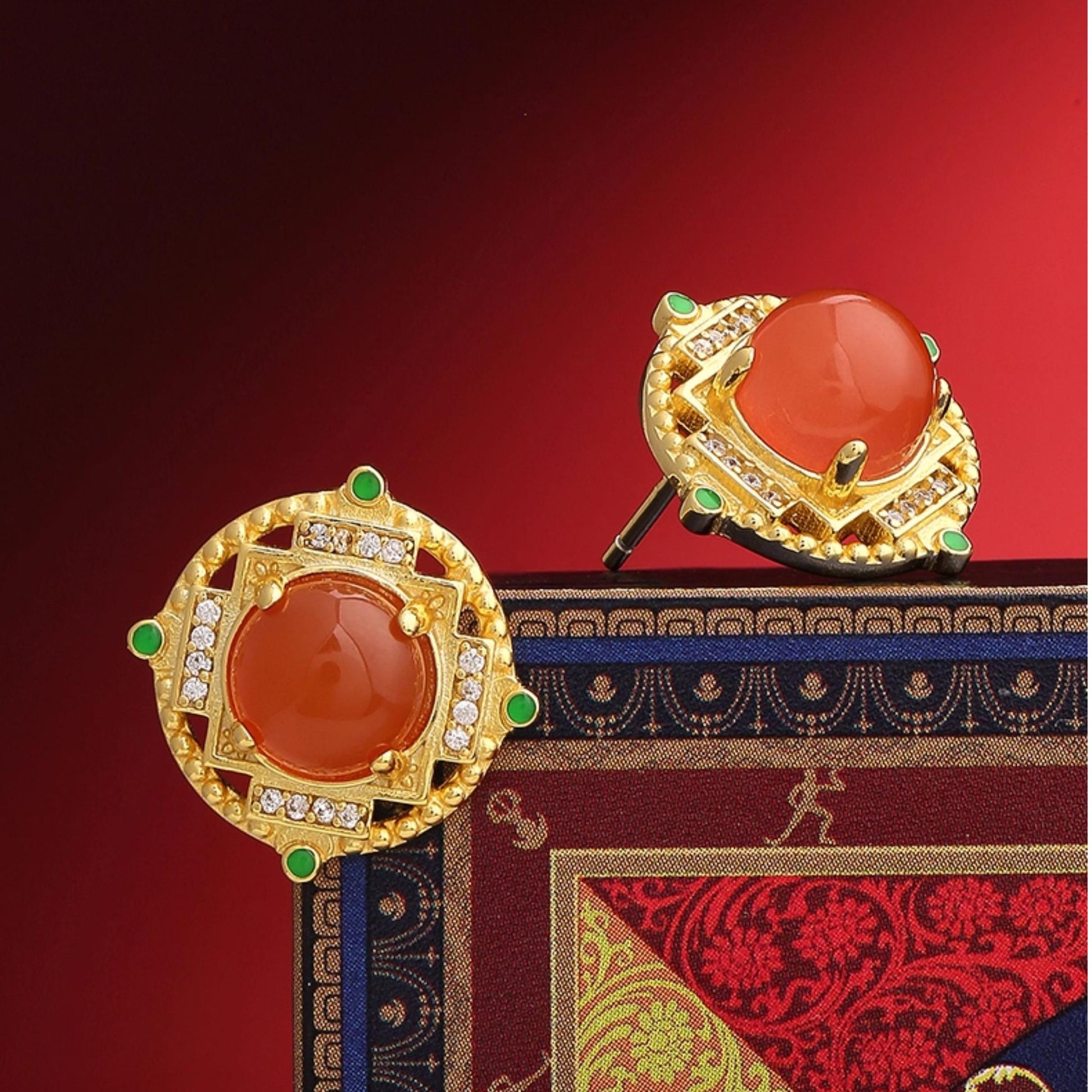 "Handmade Tibetan Buddhist Sheng Le Chang Huan ear studs with 925 silver and South Red Coral, symbolizing joy and spiritual bliss."