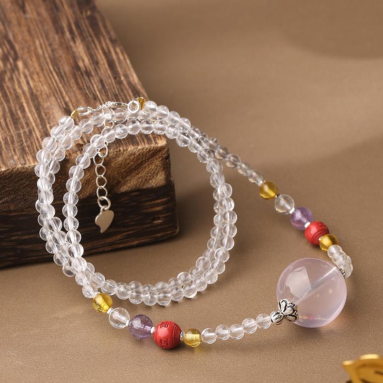 Artisan cinnabar crystal necklace representing wisdom and positive energy.