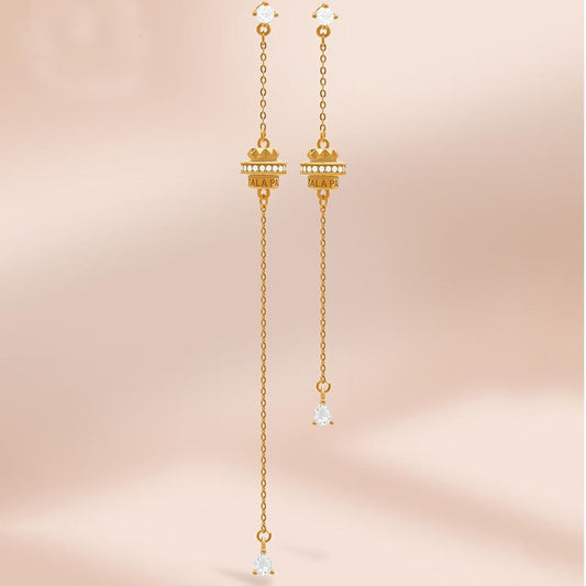 "Handmade Tibetan Buddhist Fu Lai Yun Zhuan earrings in 925 silver with 18K gold and cubic zirconia, symbolizing luck and prosperity."