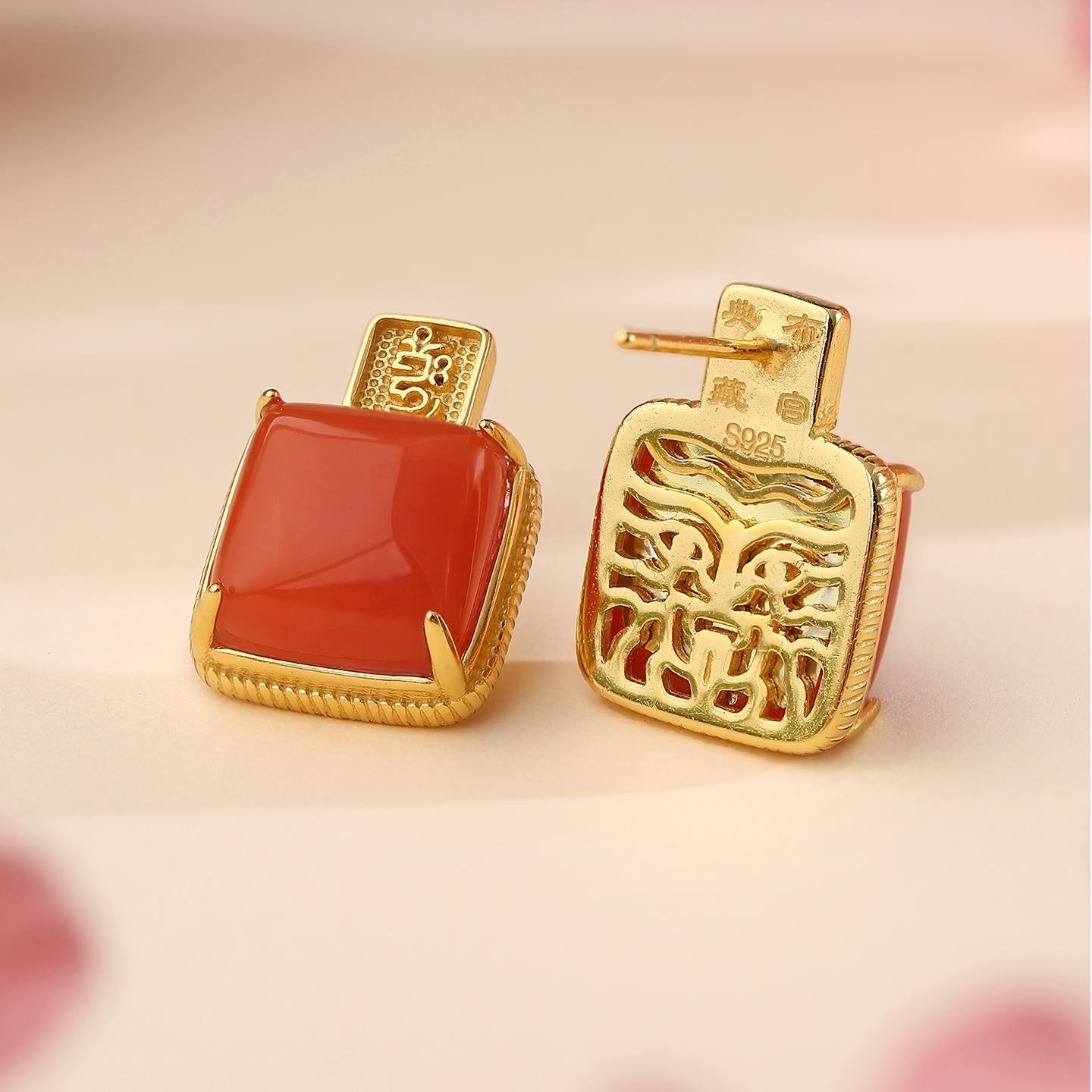 Hand-painted Buddhist jewelry with red agate and 925 silver base, symbol of spiritual abundance.