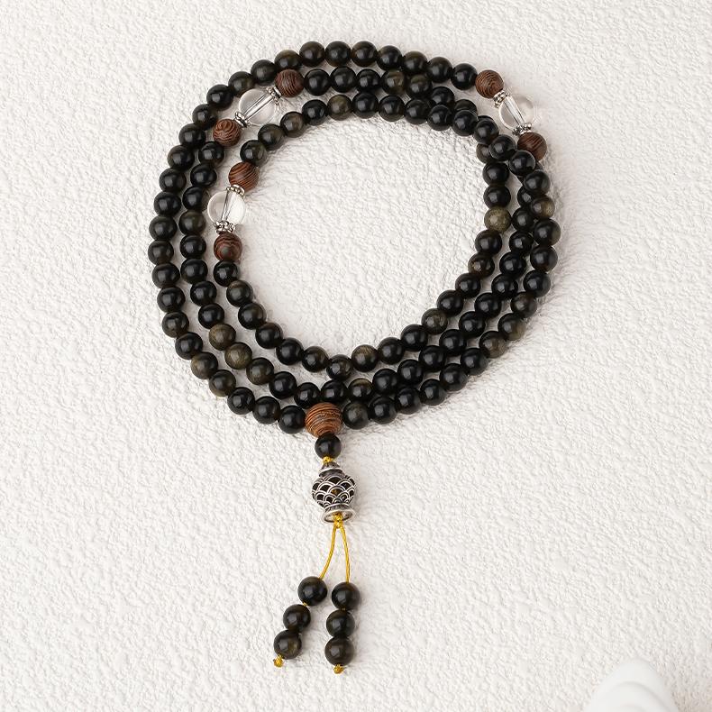 Tibetan Buddhist meditation mala made of golden obsidian, crystal and wood, 108 beads with silver ornament.