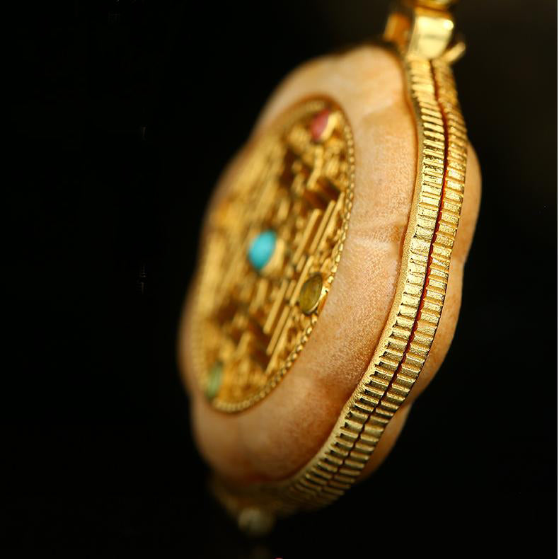 Handcrafted sandalwood and silver incense pendant representing balance and serenity.