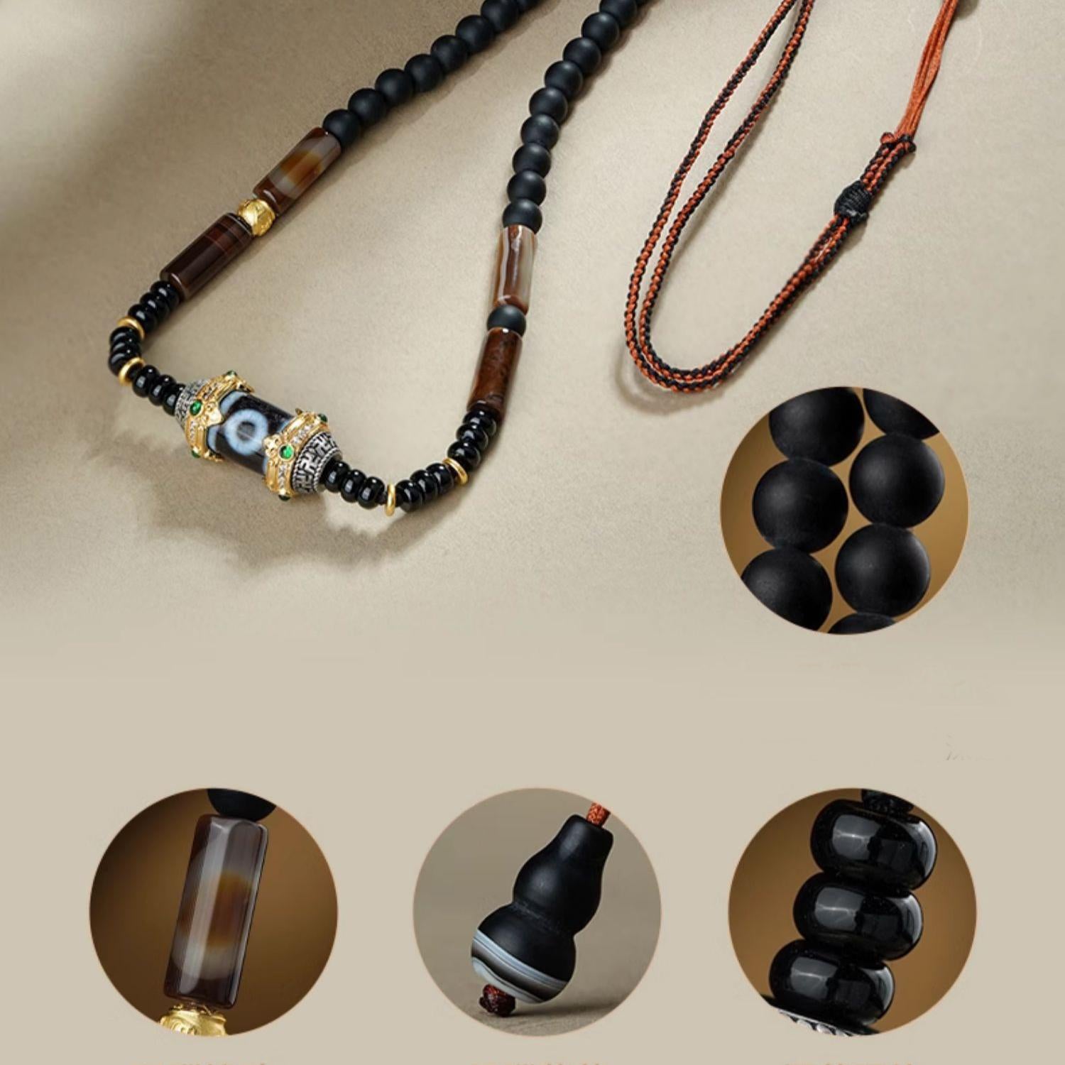 Tibetan Dzi pendant necklace combining agate, obsidian, and silver for protection and insight.