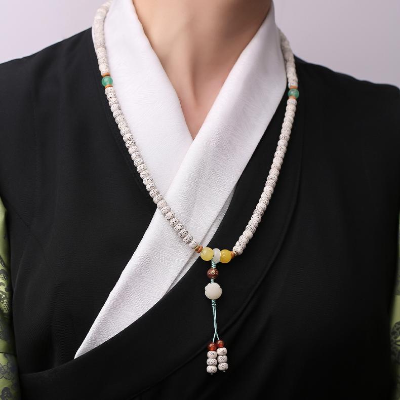 Tibetan Buddhist star-moon Bodhi mala with carnelian accents and handcrafted pendant design.