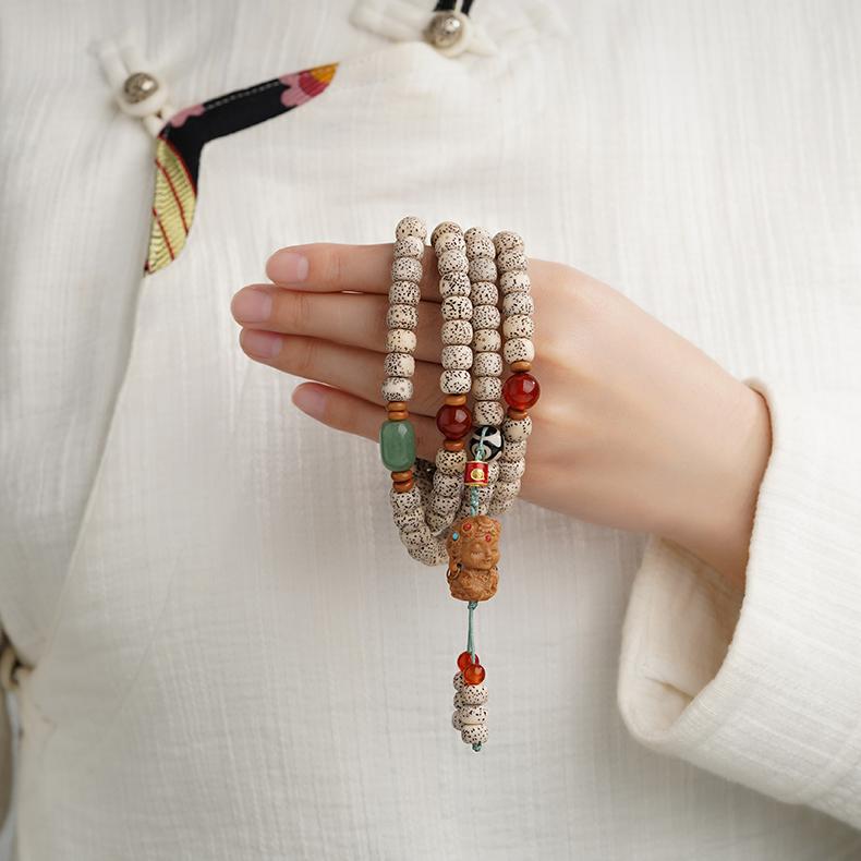 Xiangxie Bodhi 108-bead mala handcrafted with olive nut, agate and copper elements, Tibetan Buddhist meditation necklace.