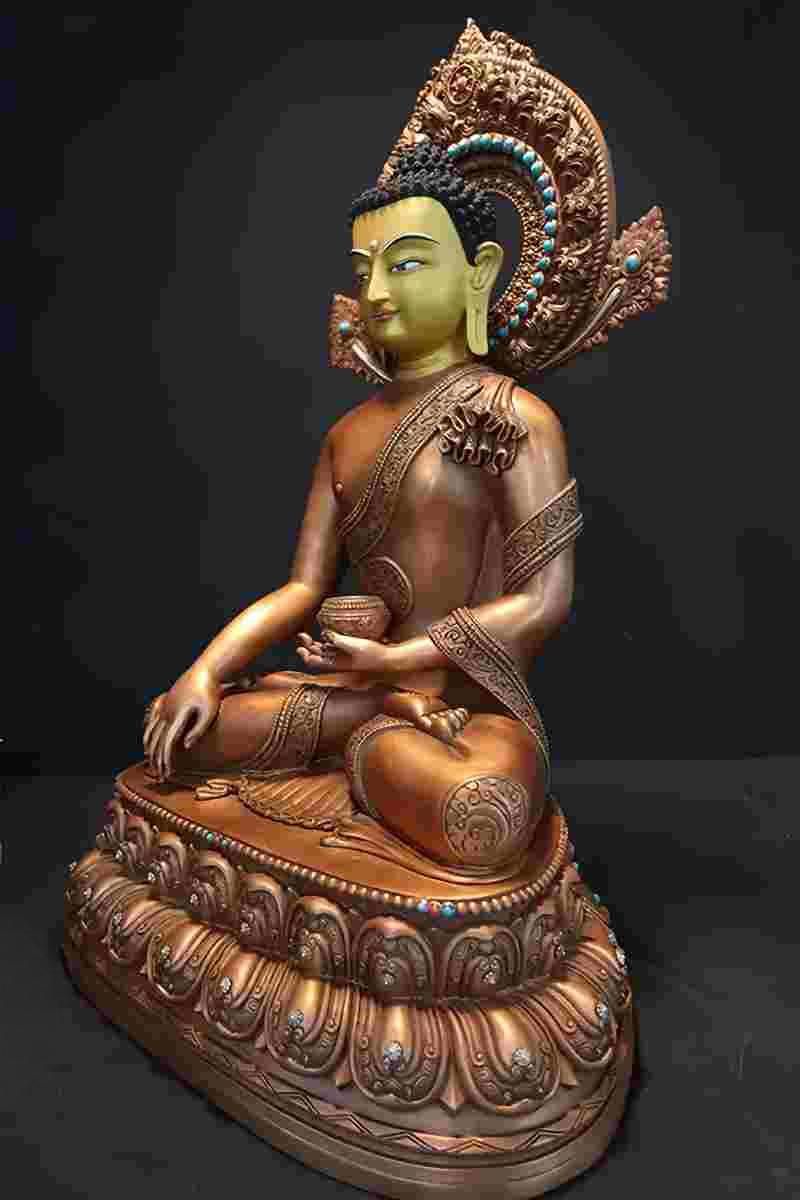 Tibetan Buddhist statues of Sakyamuni Buddha featuring luxurious gilded details. This Buddha statue art piece radiates divine presence with its brilliant brass and gold finish.