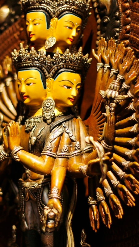 Handcrafted Thousand-Arm Avalokiteshvara Buddha Statue in purple copper, a symbol of infinite compassion and spiritual healing, meticulously painted with Tibetan Buddhist artistry.