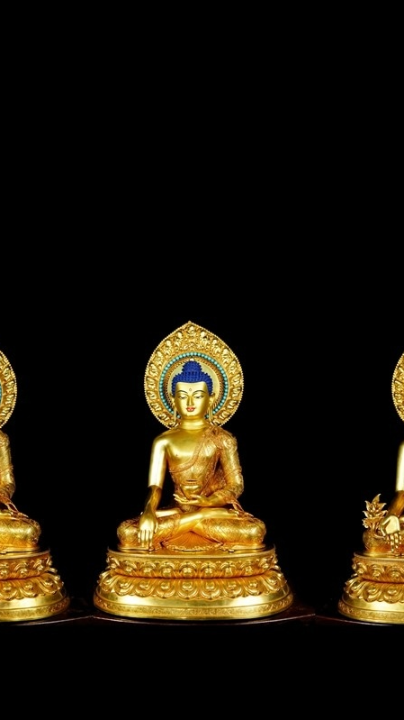A beautifully crafted Tibetan Buddhist Trinity Buddhas statue, gilded with mineral paint, perfect for those seeking rare and unique Buddhist art.
