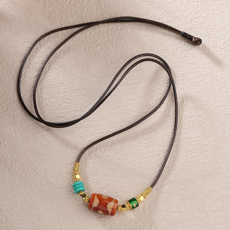 Adjustable ethnic bohemian necklace with a Red Three-Eyes Dzi charm, perfect for spiritual seekers and unique fashion.