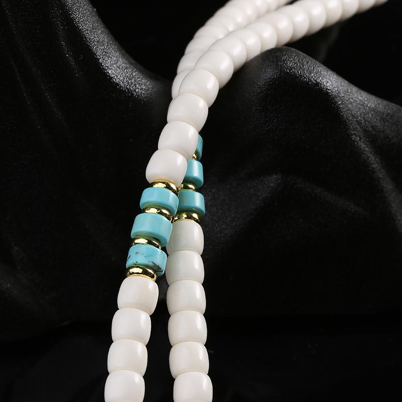 Tibetan Buddhist traditional bone and red agate mala necklace crafted with intricate pendant art