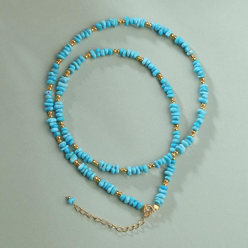 Handcrafted Tibetan Buddhist jewelry featuring turquoise stones and silver chain.
