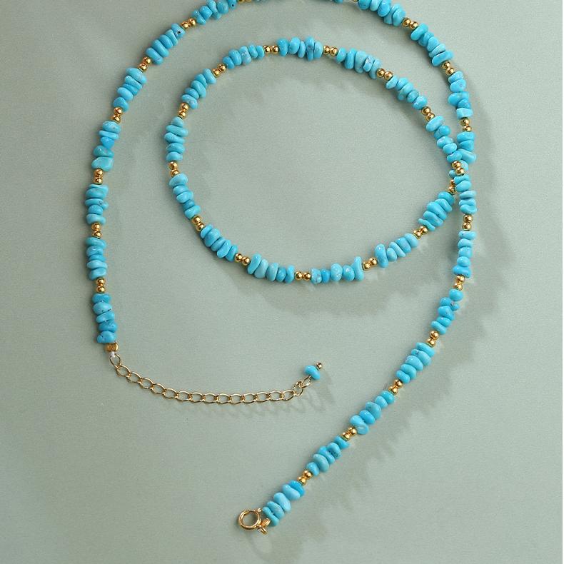 Turquoise bead necklace inspired by Tibetan Buddhist art and sacred jewelry.