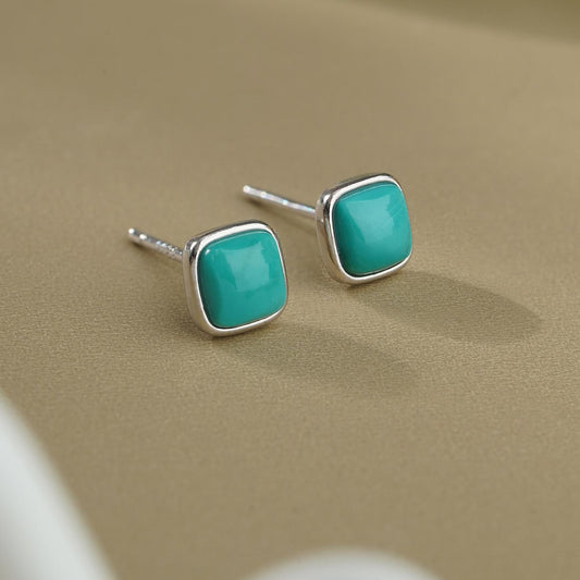 Tibetan-Buddhist bohemian turquoise earrings handmade with silver, combining Buddha art with modern Tibetan elegance.