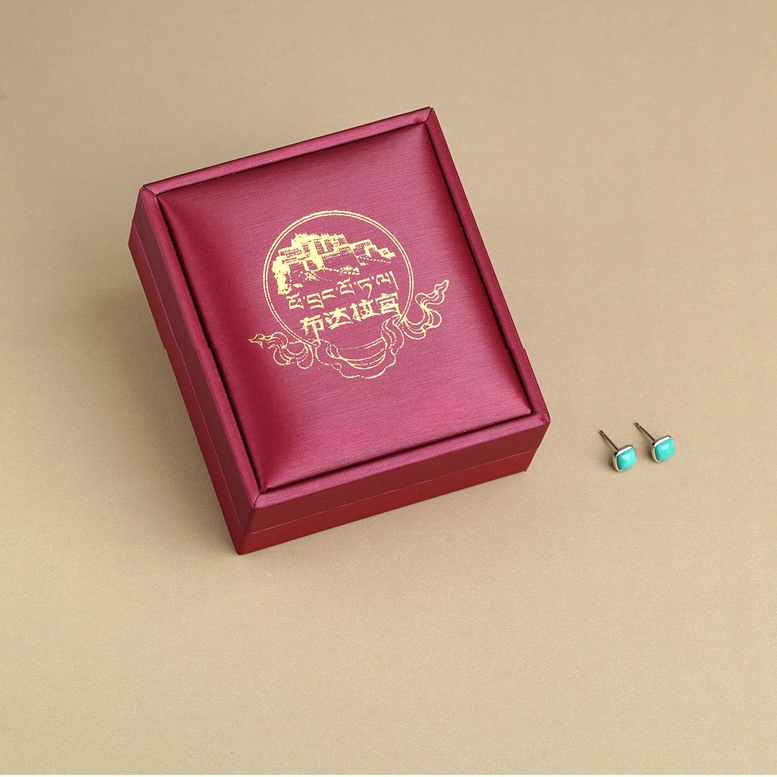 Artisan Tibetan-Buddhist turquoise stone earrings crafted in 925 silver, inspired by ancient Buddha art symbolism.
