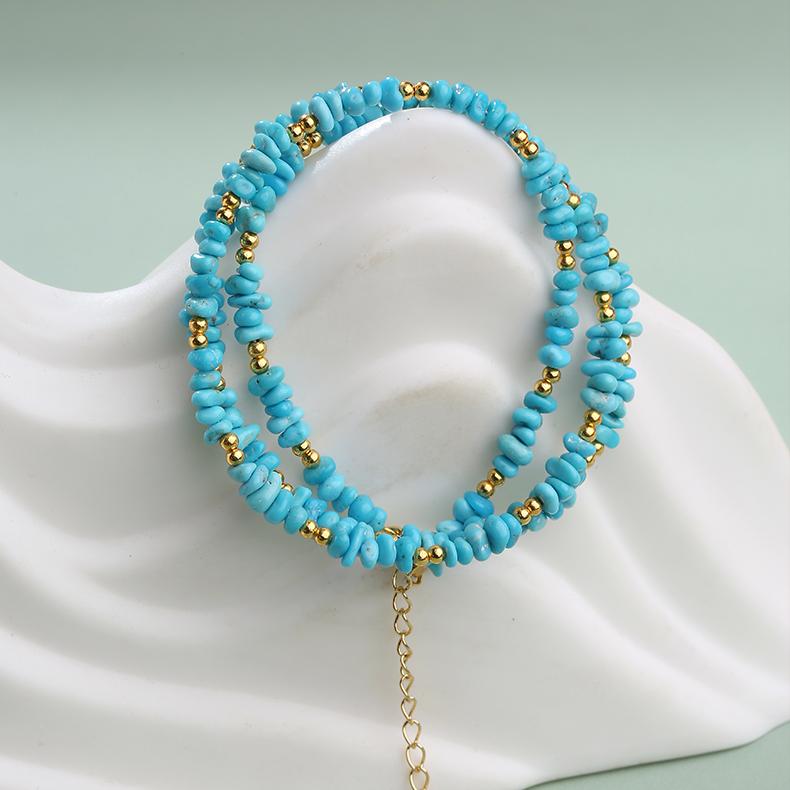 Handmade turquoise and silver Buddhist necklace symbolizing wisdom and serenity.
