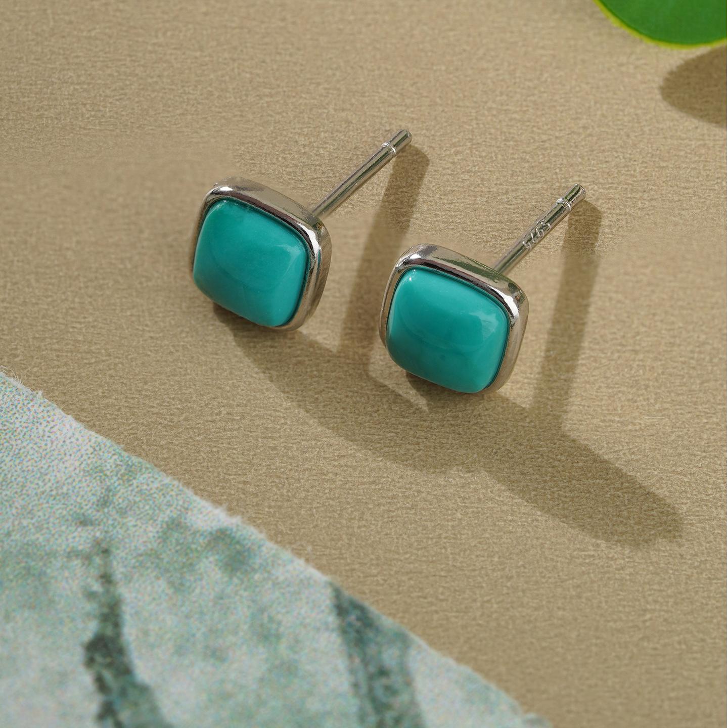 Tibetan-Buddhist turquoise and silver earrings representing Buddha art and inner harmony, handmade with devotion.