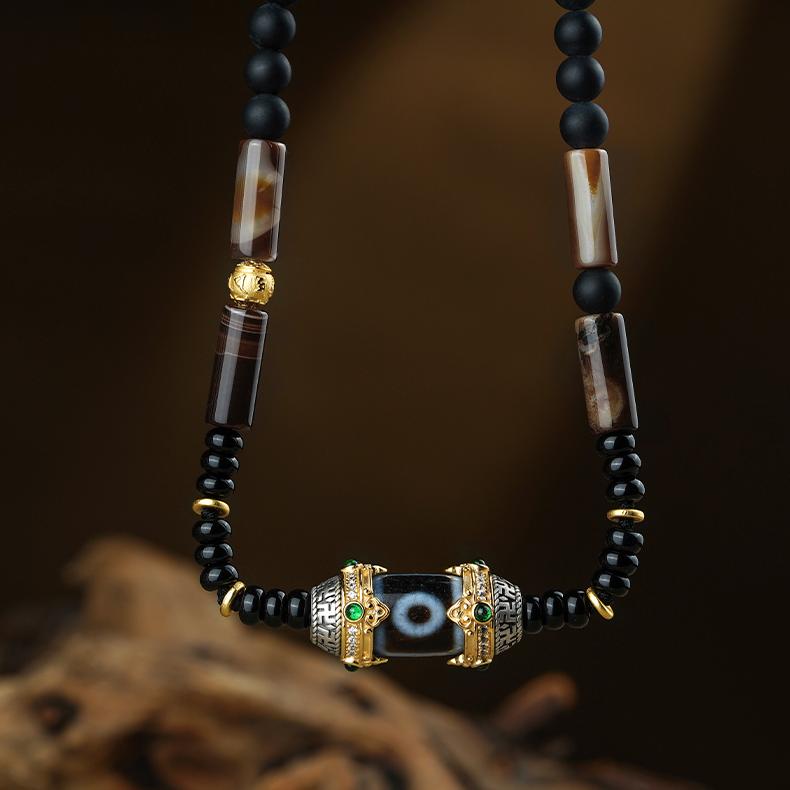 Handcrafted Tibetan Two-Eyed Dzi Bead Necklace made with agate, obsidian, coconut shell, and s925 silver.